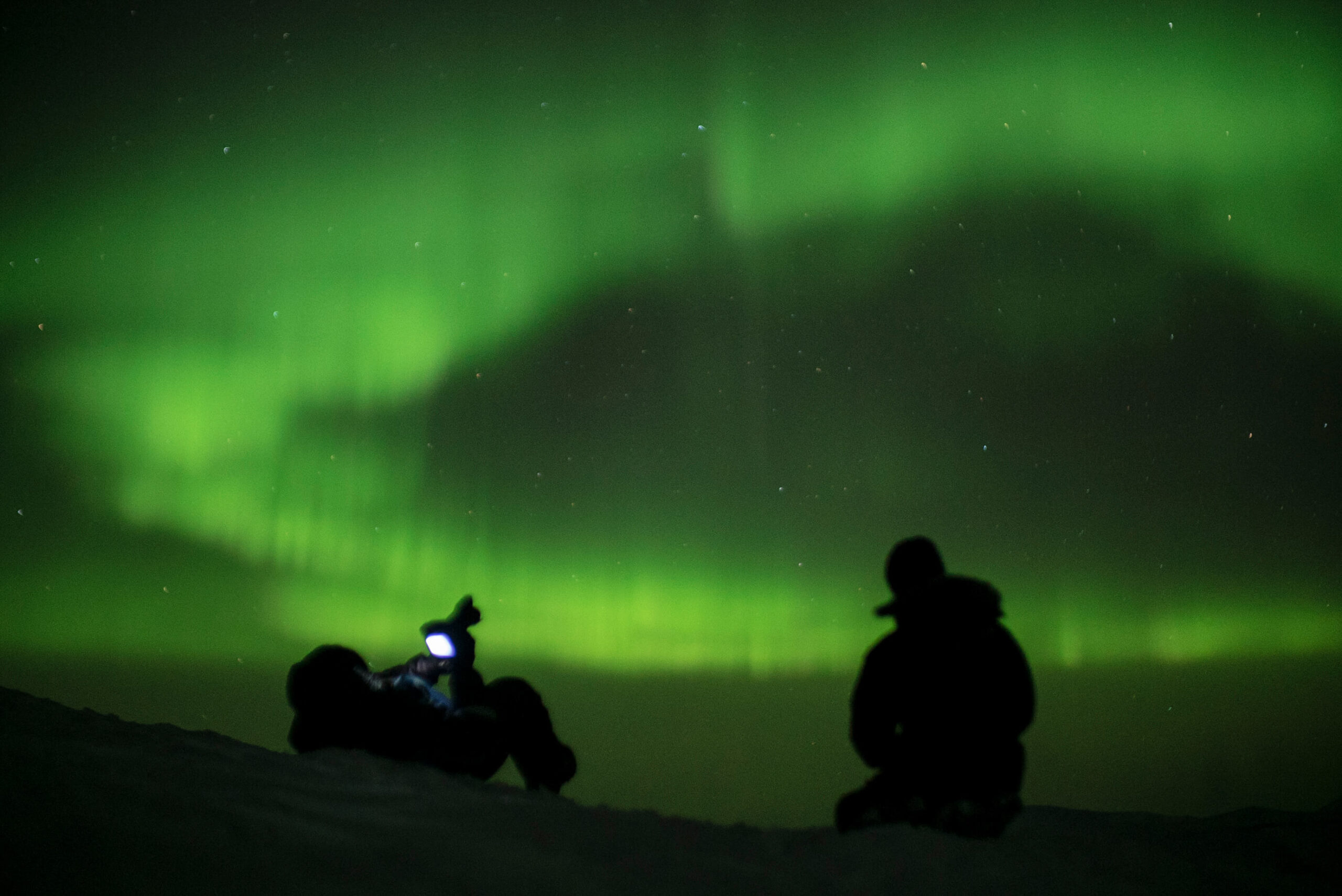 Aurora over the Arctic landscape